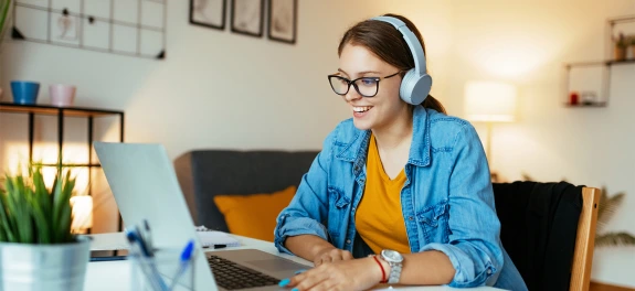 Smiling student using computer