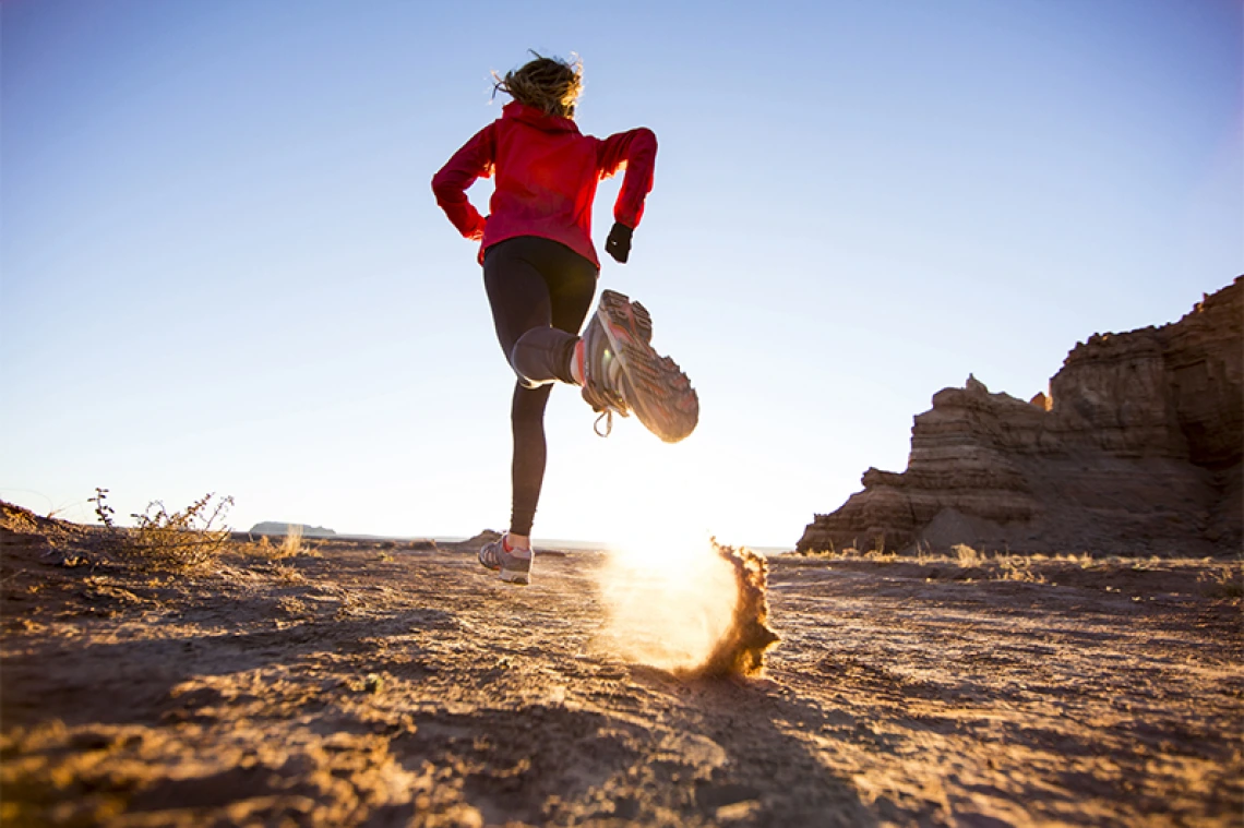 Person running in desert setting