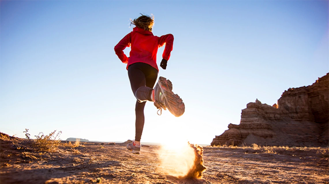 Person running in desert setting