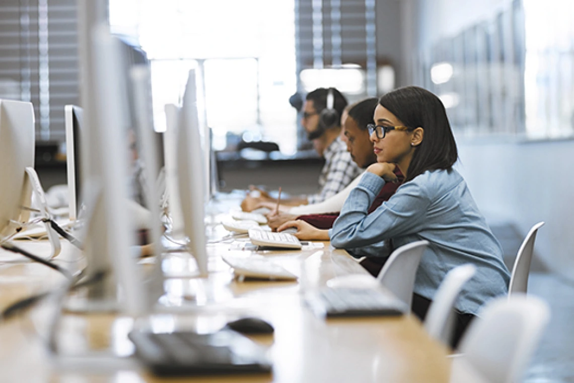 Student working on computer in computer lab setting